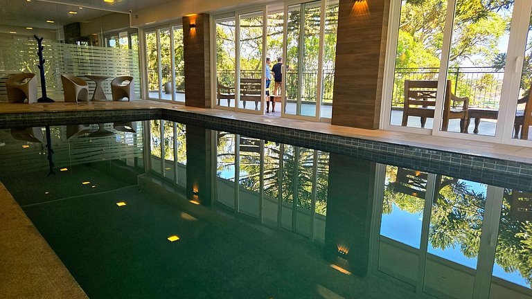 Flat com Lareira e Piscina Aquecida em Canela
